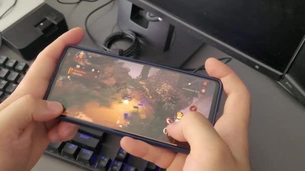 Playing Diablo Immortal Mobile Game Mobile Phone — Stockvideo