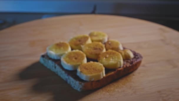Wholemeal Toast Blueberry Jam Peanut Butter Ripe Banana Slices Cinnamon — Stockvideo