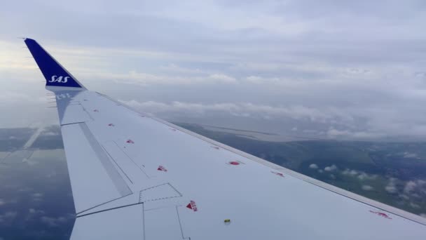 Sas Bombardier Commercial Jet Airplane Wing Flying Denmark Cloudy Day — Vídeo de stock