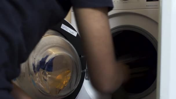 Asian Male Taking Out Clothes Washing Machine Locked — Stock video