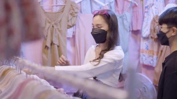 Couple Looking Clothes Cloth Store Both Wearing Black Masks One — Video Stock