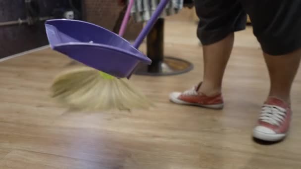 Commercial Video Man Sweeping Floor Broom Wearing Disposable Masks Gloves — Stockvideo