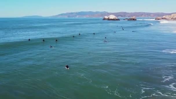 Large Group Surfers Sitting Paddling Out Ocean Waiting Set Waves — Stockvideo