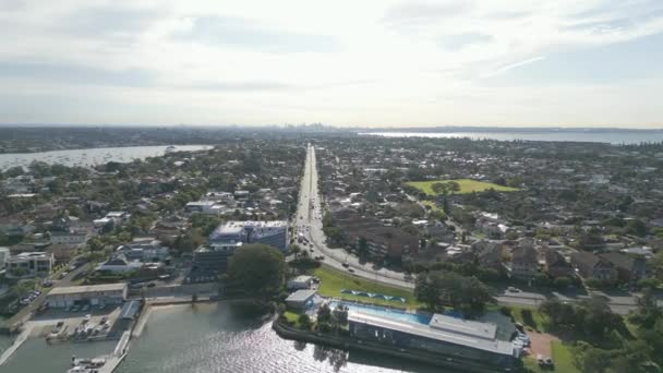 Aerial Forward Flying Dual Carriageway Highway Properties Cinematic Ocean Shot — Vídeos de Stock