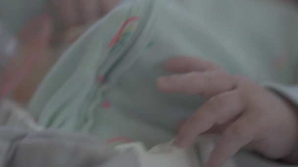 Close Little Hand Pacifier Baby Bouncing Swinging Rocker — Video