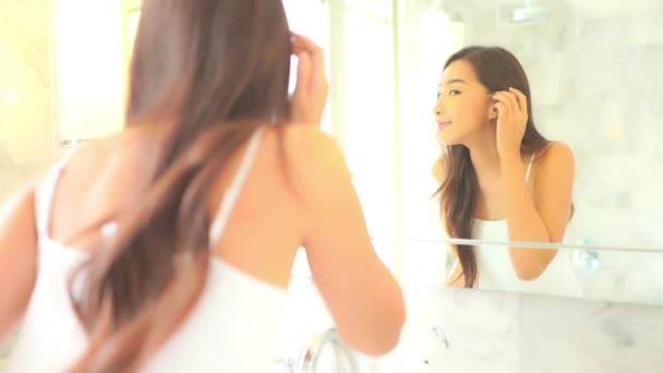 Beautiful Asian Woman Looking Mirror Touching Face — Stockvideo