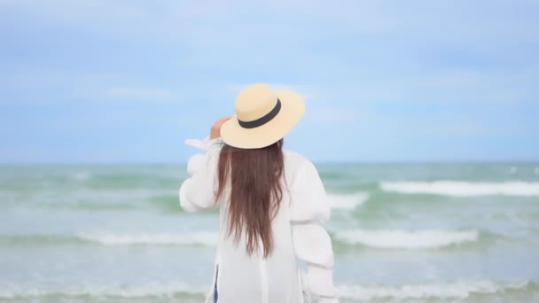 Woman White Blouse Standing Beach Sea Raising Arms Facing Endless — Αρχείο Βίντεο
