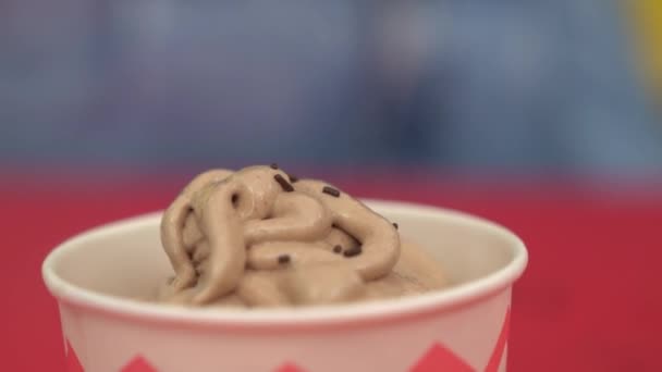 Close Chocolate Sprinkles Falling Ice Cream Cup — Stockvideo