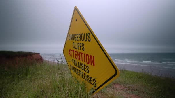 Yellow Red Sign Warning Dangerous Cliffs Next Ocean — ストック動画