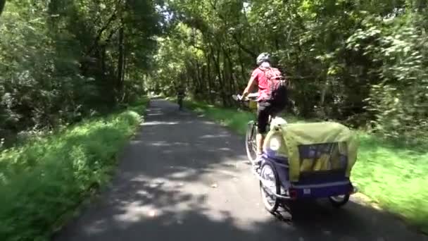 Closeup Senior Woman Pulling Trailer Her Bike White Poodle Dog — Stock video