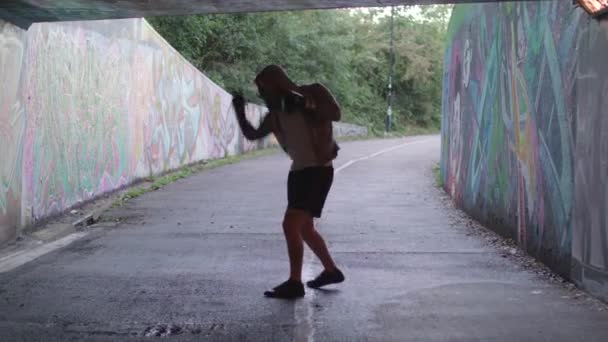 Young Active Man Boxing Underpass Silhouetted Light — 图库视频影像