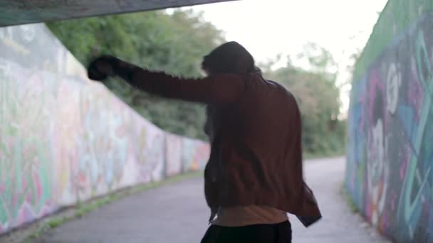 Medium Shot Young Active Man Boxing Underpass Silhouetted Light — Vídeos de Stock