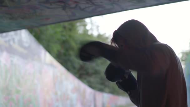 Close Shot Young Active Man Boxing Underpass Silhouetted Light — Vídeos de Stock