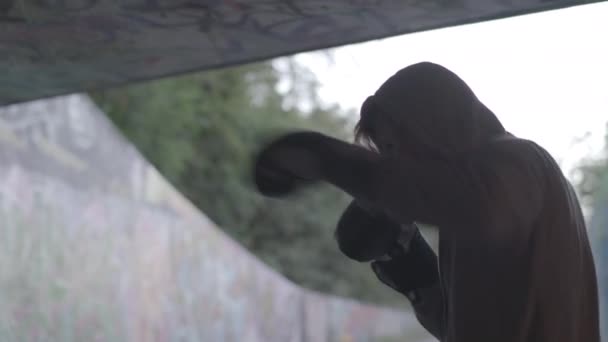 Close Shot Young Active Man Boxing Underpass Silhouetted Light Ungraded — Video