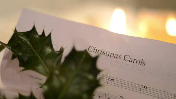 Christmas Carol Music Sheet Candles Holly — стокове відео