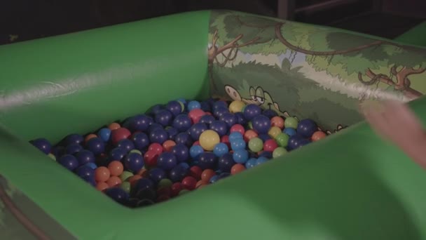 Young Boy Diving Ball Pit Laughing Afterwards — Vídeo de Stock