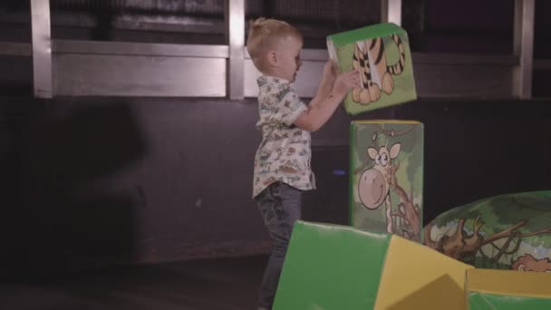 Young Happy Boy Stacking Large Soft Play Blocks — Stock Video