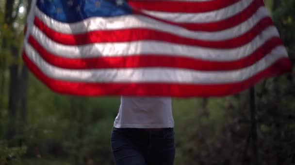 Pretty Mature Woman Wearing Sunglasses Smiling Pulls American Flag Her — Vídeo de Stock
