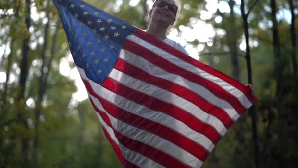 Pretty Blonde Woman Drapes American Flag Her Body Slow Motion — Stockvideo