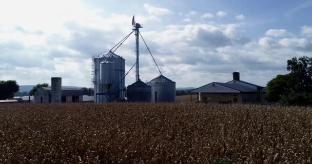 Ascending Aerial Camera View Cornfields Grain Silos American Flag Top — Stockvideo