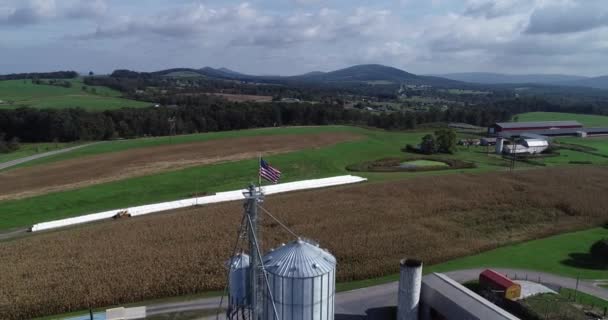 Aerial View Pulling Away American Flag Top Grain Silo Cornfields — Wideo stockowe