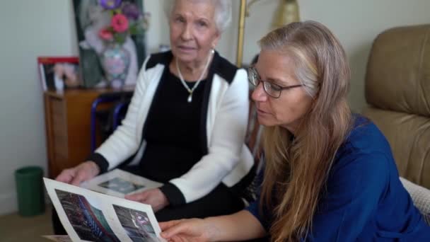 Closeup Mature Blonde Woman Looking Photo Album Talking Elderly Gray — Vídeos de Stock