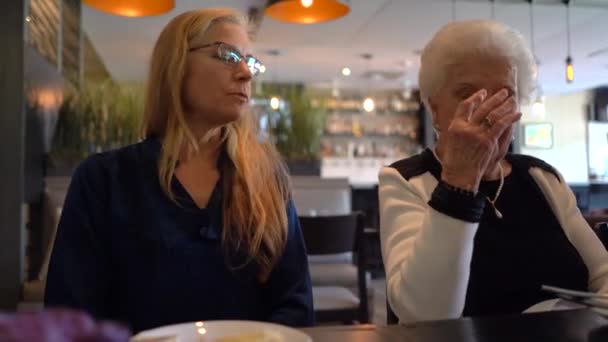 Mature Woman Elderly Woman Sitting Table Restaurant Laughing Talking — Wideo stockowe