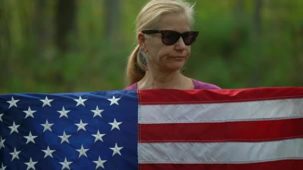 Closeup Pretty Blonde Woman Holding American Flag Motioning Her Head — 비디오