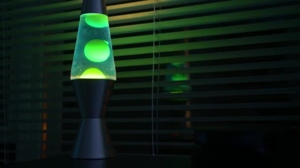 Green Lava Lamp Time Lapse Dark Room Office Window — Stok video