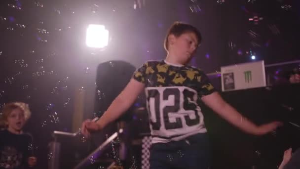 Young Boy Dancing Party Whilst Bubbles Blown All Him — Vídeos de Stock