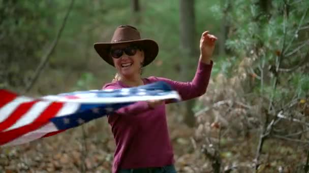 Slow Motion Woman Cowboy Hat Flag Whip Flag While Smiling — Vídeo de Stock