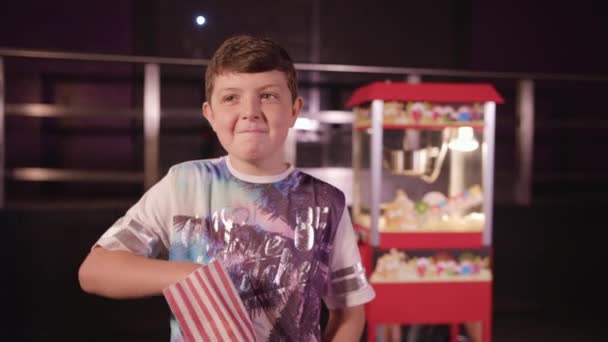 Young Boy Munching Pop Corn Happily — Stock Video