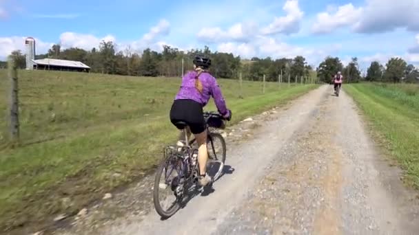 Woman Biking Her Son Distance Rural Gravel Road — 图库视频影像
