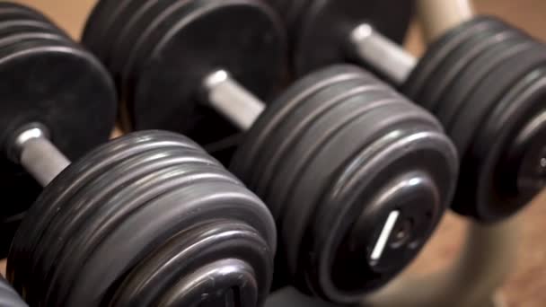 Closeup Slow Slider Shot Left Looking Row Dumbbells Rack — Vídeos de Stock