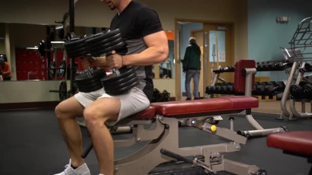 Teen Male Bodybuilder Lies Bench Presses Heavy Dumbbells Turning Them — Stock video