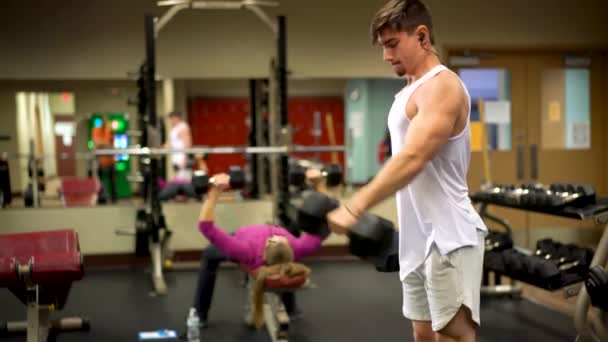 Young Bodybuilder Using Heavy Dumbbell Doing Front Alternating Dumbbell Raises — Video