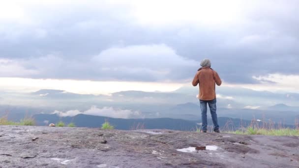 Young Man Standing Top Cliff Enjoying View Nature — ストック動画