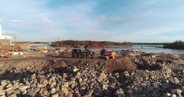 Slow Forward Tracking Aerial Shot Becoming Static Excavator Digging Loading — Stockvideo