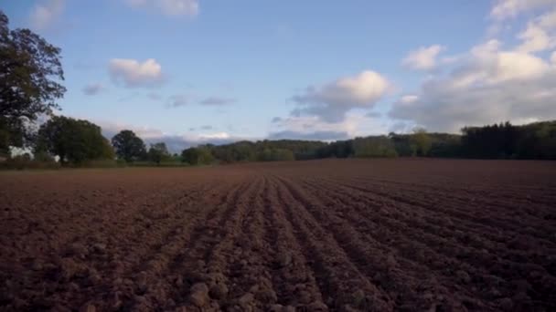 Handheld Descent Ploughed Muddy Field — Stockvideo