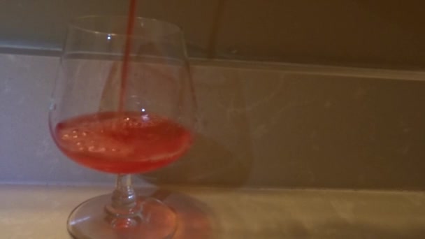 Frontal Shot Red Liquid Being Poured Wine Glass — стоковое видео