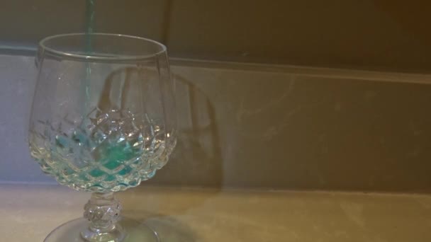 Frontal Shot Blue Liquid Being Poured Wine Glass — 图库视频影像