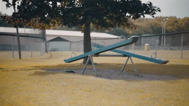 Abandoned Empty Moving Seesaw Teeter Totter Children Playground Autumn Prores — Stock video