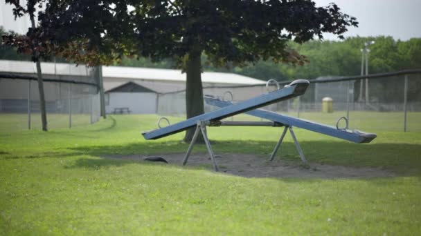 Abandoned Empty Moving Seesaw Teeter Totter Children Playground Summer Prores — ストック動画