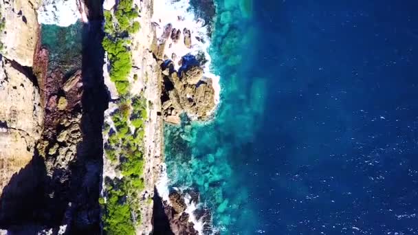 Drone Looking Straight While Flying Long Narrow Rock Structure Sea — Video