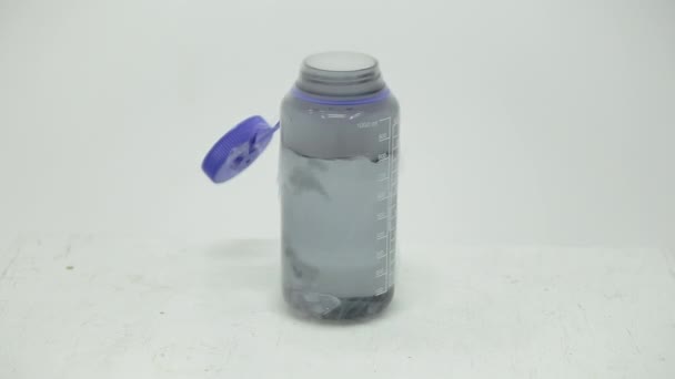 Dry Ice Cube Bubbling Bottle — Stock Video
