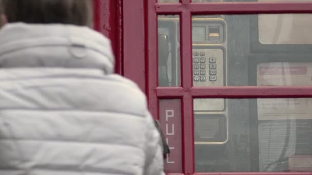 Entering Public Payphone England — Stockvideo