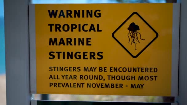 Close Shot Marine Stinger Warning Sign Camera Slides Left Revealing — Stockvideo