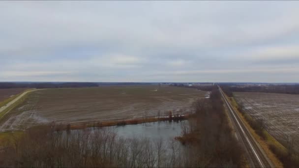 Cars Trucks Bus Traveling Overpass Running Railroad Tracks Next Pond — Stockvideo