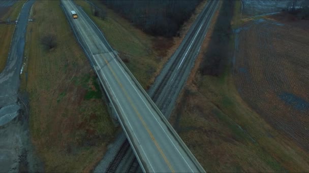 Cars Trucks Bus Traveling Overpass Running Railroad Tracks Next Pond — Stockvideo