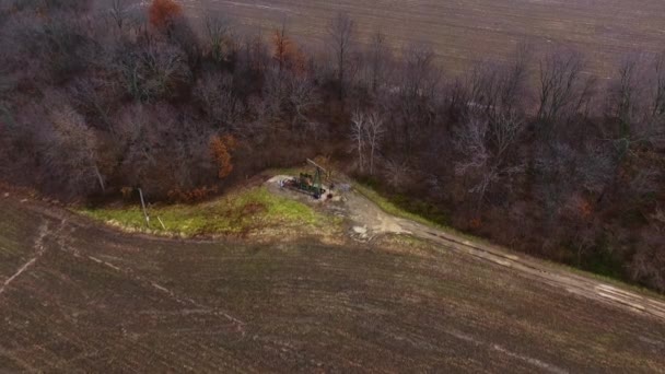 Drone Flyover High Pump Jack Working Old Oilfield Tree Line — Stock Video